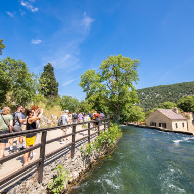 Visitors at the entrance of Krka Waterfalls Park - a green oasis of Croatia